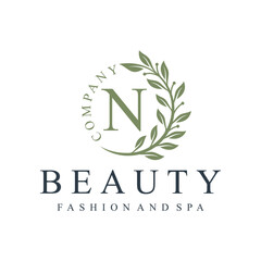 Initial letter n green leaves natural organic logo design for to beauty fashion and spa design graphic 