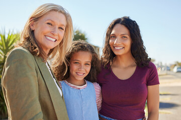 Cute little girl with happy mother and beautiful grandmother