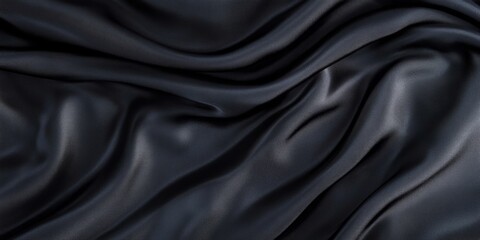 Obraz premium Luxurious Black Silk Fabric with Smooth Texture Creating Elegant Waves and Dark Shadows for Design