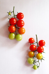 Fresh cherry tomatoes on a clean white background. Ripe organic vegetables with copy space, ideal for food design, healthy lifestyle, farm market, or natural product packaging.