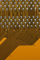 orange old circuit board with contacts and solders with an electronic closeup, an electronic board...