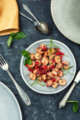Fried seafood shrimps with berries sauce.