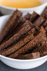 fried bread pieces until crisp in sunflower oil , delicious crispy rye bread croutons for sauce, close up