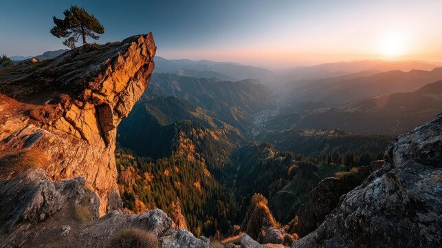 breathtaking sunset illuminates the mountains and valley. rocky cliff provides a stunning viewpoint, surrounded by trees and autumn colors beneath the skys warm glow - Powered by Adobe