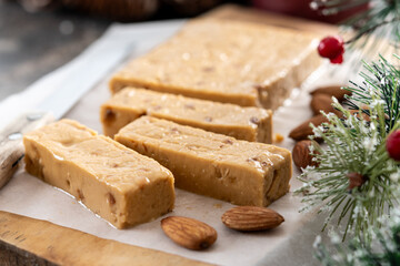 Christmas soft almond nougat bar on wooden table