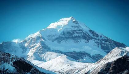 Obraz premium Breathtaking Snowy Mountain Peak Against a Clear Azure Sky, Showcasing Nature s Majestic Beauty