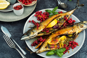 Fried or baked mackerel fish with berries.