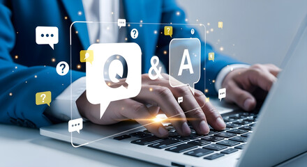 Business professional typing on laptop with digital q a icons and network connections