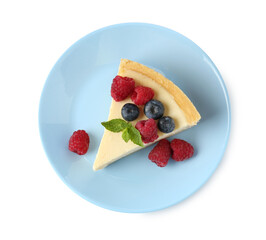 Piece of delicious cheesecake with fresh berries and mint isolated on white, top view