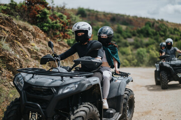 Friends explore rugged terrains on quad bikes wearing helmets, enjoying adventure and teamwork...