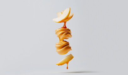 Creative food concept of levitating apple and caramel swirl splash