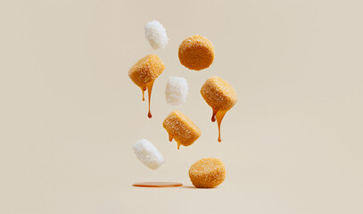 Dynamic levitation of coconut cookies with dripping caramel sauce, an abstract food concept on a minimalist beige background