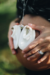 pregnant woman holding her belly