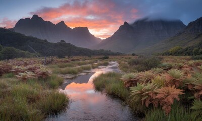 Sunrise over mountain valley, tranquil stream