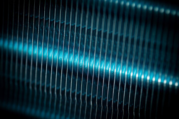 Abstract blue textured metallic background - air conditioner radiator grille.