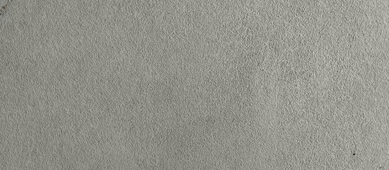 Close up of a textured grey concrete surface Keywords: concrete, texture, background, grey