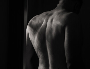 Flex, man and bodybuilder with muscles in studio for bicep strength or strong body on dark background. 