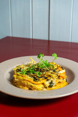 Vegetarian &Aacute; Br&aacute;s dish inspired by traditional Bacalhau &agrave; Br&aacute;s, made with fresh vegetables, eggs, and herbs, crafted by a chef for a healthy gourmet meal.