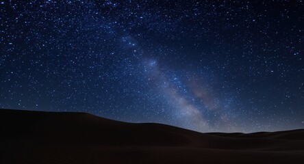Fototapeta premium Starry night sky, Milky Way galaxy, dark dunes in foreground
