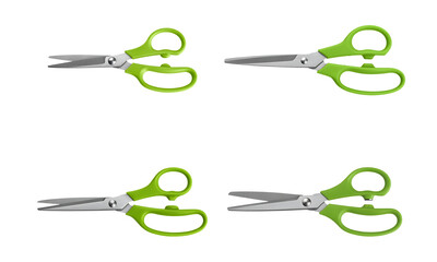 Green handle scissors isolated on white background for cutting or craft tool concept
