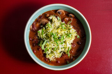 Hearty vegetarian mushroom feijoada crafted by a chef, a traditional Portuguese stew made with mushrooms, beans, and rich spices, perfect for plant-based meals.