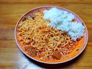 Spicy fried noodles in a bowl 