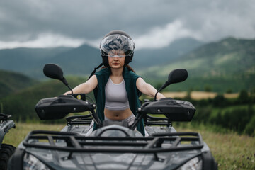Fototapeta premium An individual riding an ATV through a picturesque mountain landscape under cloudy weather conditions, showcasing adventure and exploration with a connection to nature and outdoor activities.