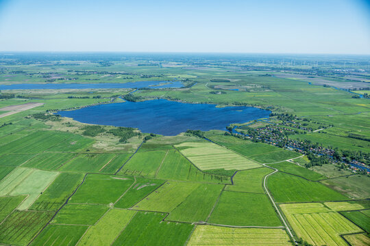 Aerial landscape of rural lake area and farm land in western Denmark.