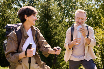 Couple enjoys a joyful hike together in nature, embracing adventure and connection