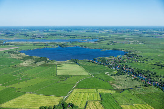 Aerial landscape of rural lake area and farm land in western Denmark.