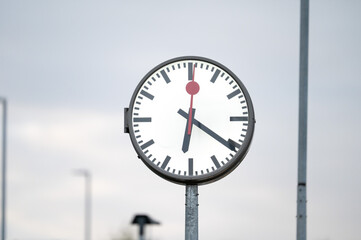 Classic analog clock at the railway station of Tienen, Belgium