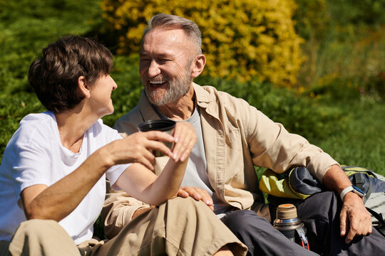 Seniors share laughter while enjoying nature during a mountain hike together