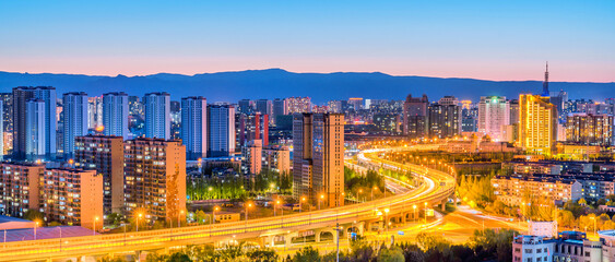 Fototapeta premium Night view of urban skyline in Jinqiao Development Zone, Hohhot, Inner Mongolia, China