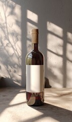 Fototapeta premium A wine bottle mockup with a clean white label is styled with minimalist plant decor, offering a modern look for branding design.