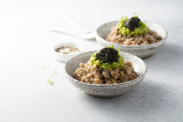 Green buckwheat with avocado and caviar