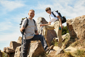Active seniors enjoying a scenic hike together on a beautiful mountain trail