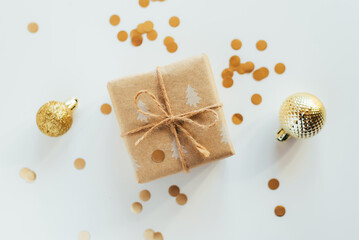 Christmas gift box and decorations on white background