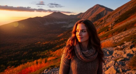 A radiant young woman with long, flowing brown hair, dressed warmly in a cozy knitted sweater and scarf, gazes thoughtfully into the distance. She stands atop a majestic mountain range bathed in the e