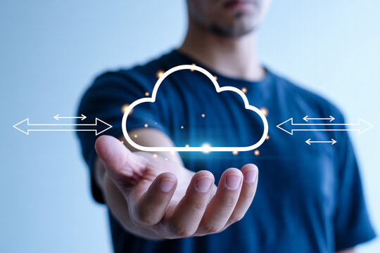 Cloud computing technology concept man holding cloud data storage and network service solution 100