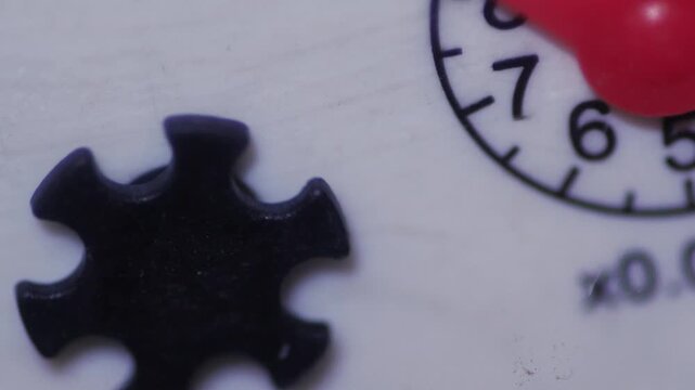Close-up of a rotating needle and impeller of a water meter, a water meter counts water consumption, a water metering system
