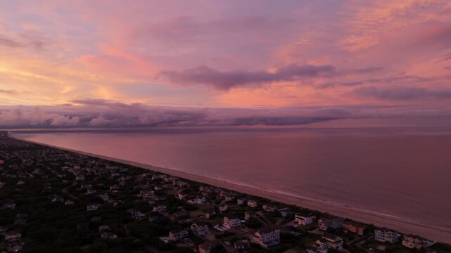 Sunset overlooking a small beach town in the summer.