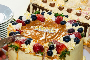 Cutting a birthday cake. Birthday party