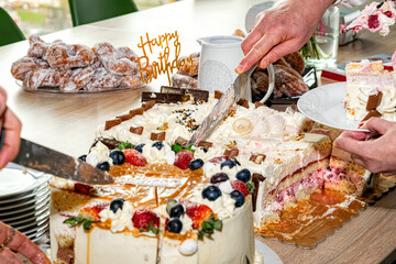 Cutting a birthday cake. Birthday party