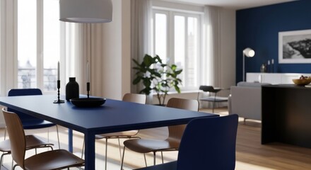 Fototapeta premium Sunlit modern dining room with blue table, chairs, and blurred living area beyond