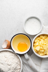 Overhead view of mise en place of ingredients used to make tart shell dough, top view of items used to make pie crust dough