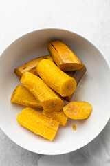 overhead view of Boiled ripe plantain in a white bowl, top view of nigerian cooked ripe plantain