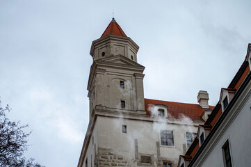 Obraz premium Bratislava Castle is massive rectangular building with four corner towers stands on an isolated rocky hill of the Little Carpathians in Bratislava