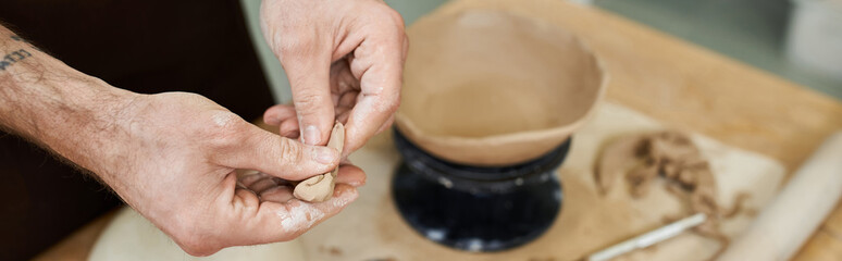 Crafting beauty with hands at a pottery studio located in a creative space