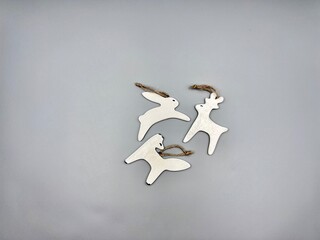 Christmas decorations ceramic animals deer hare fox in Scandinavian minimalist style top view on light background