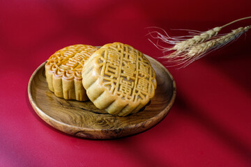 Two traditional mooncake with the text 